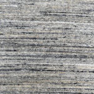 Textured rug pile featuring thick, variegated gray and cream horizontal bands across the surface.