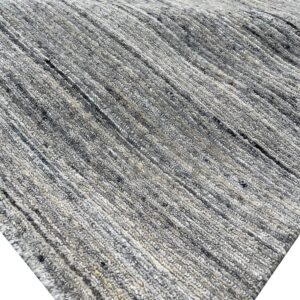 Heathered gray rug with a chunky, ribbed texture, featuring distinct vertical or diagonal rows of loops.