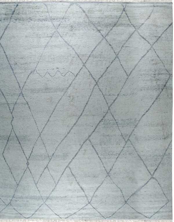 Pale blue shaggy rug with an irregular dark gray diamond trellis pattern and short white fringe.