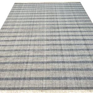 Low-profile rug featuring alternating light and dark gray horizontal stripes and short fringed ends.