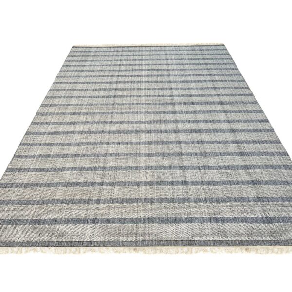 Gray and light gray textured rug featuring thick horizontal stripes and short fringe on a white background.