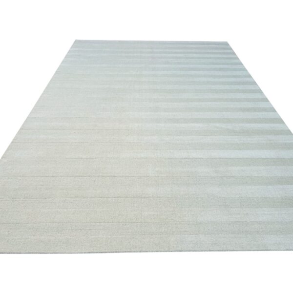 Pale sage area rug isolated on white, featuring subtle tone-on-tone horizontal striping.