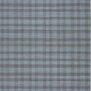 Textured flatweave rug in muted blue and grayish-brown featuring a subtle checked pattern.