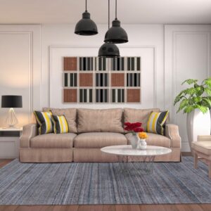 Slate blue and gray chunky textured rug grounding a neutral contemporary living room with wood floors.