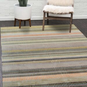 Multicolor striped rug in yellow, gray, orange, and blue rests on dark wood floors near a furry chair.