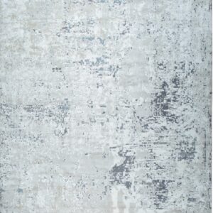 Abstract rug featuring a distressed pattern with patches of gray, white, pale blue, and light beige.