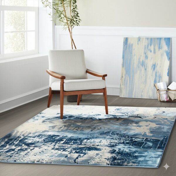 A rectangular blue, grey, and cream abstract rug anchors a sitting area with a white wooden armchair and large window.