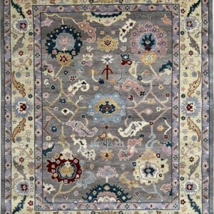 Gray traditional rug with multi-colored floral medallions and an ornate cream and lavender border.