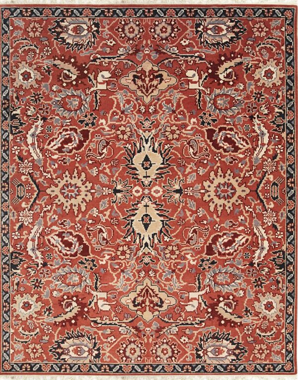 A rust red rug featuring a detailed traditional medallion and floral pattern in beige, gray, and navy.