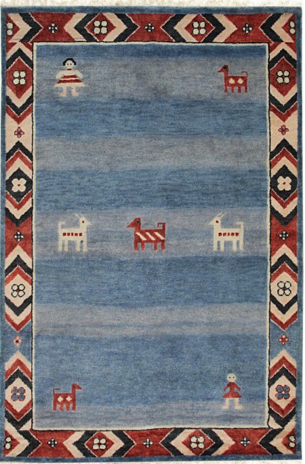 Blue abrash rug with folk figures and a thick geometric border in red, cream, and dark blue.