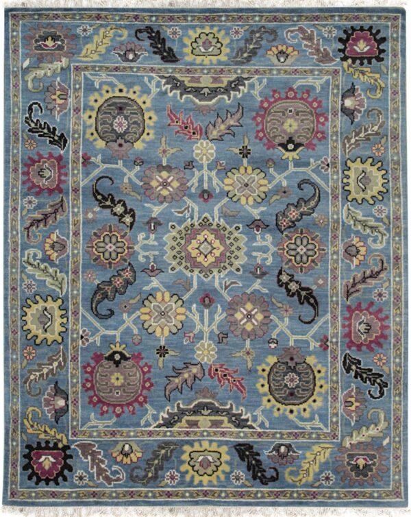 Blue rug featuring a detailed traditional floral and botanical pattern in yellow, burgundy, and gray.