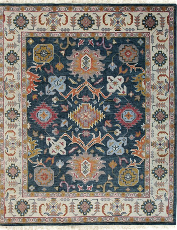 Deep navy rug with traditional rust, gold, red, and slate blue motifs on a textured pile.