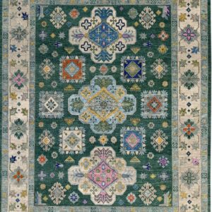 Green traditional rug with a central geometric pattern and multicolored floral motifs on a beige border.