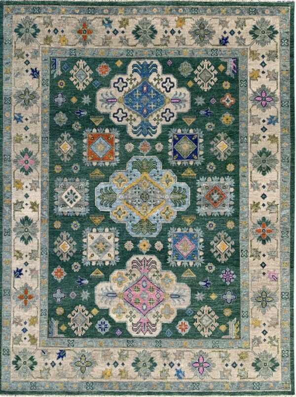 Green traditional rug with a central geometric pattern and multicolored floral motifs on a beige border.