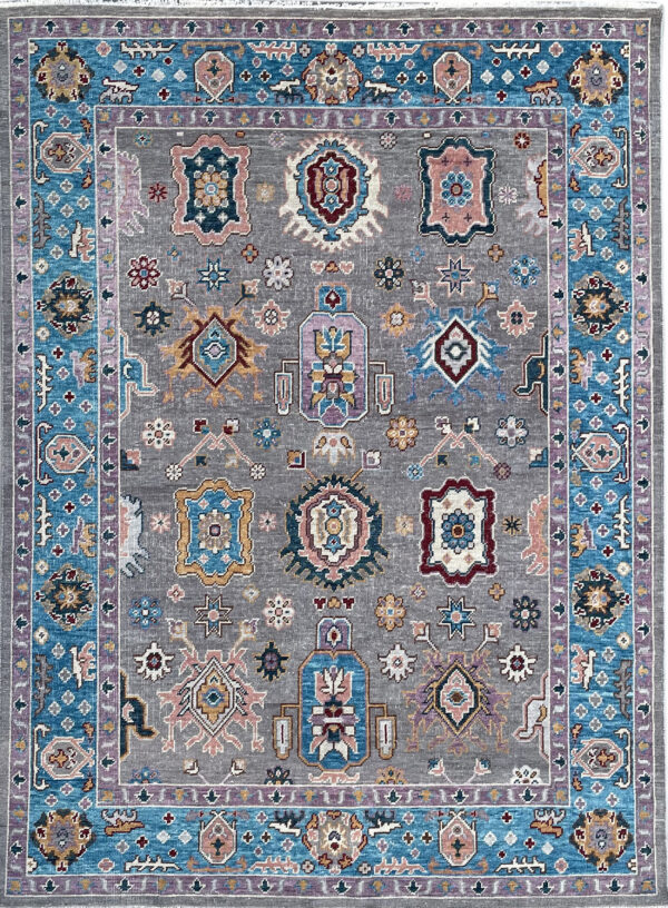 Traditional gray rug featuring colorful medallions and a prominent bright blue and purple patterned border.