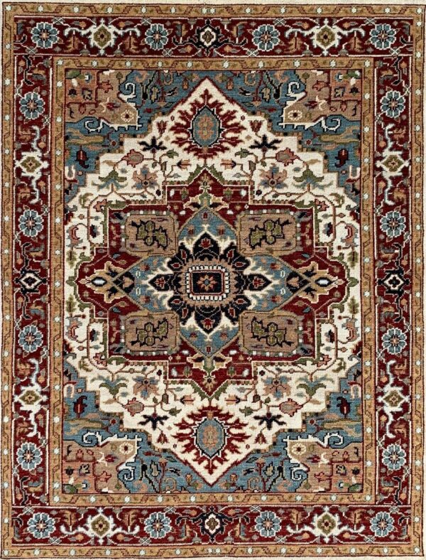 Ornate traditional rug displaying a large medallion design in deep red, blue, cream, and tan colors.