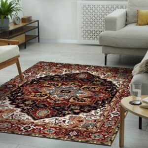 Ornate red and navy traditional rug laid on light wood floors beneath modern light gray seating.