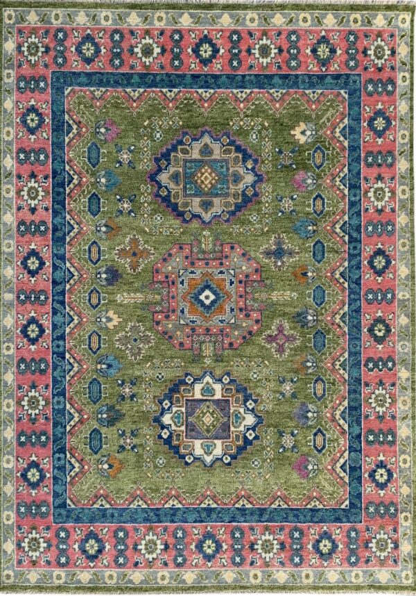 Distressed olive green traditional rug with intricate navy blue and dusty rose borders and geometric designs.
