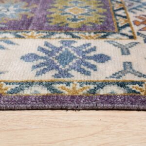 Textured purple, blue, and cream traditional rug border on light hardwood flooring.