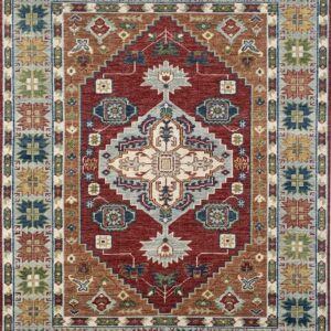 Traditional geometric rug featuring a red field, central medallion, and borders in blue, rust, and cream.