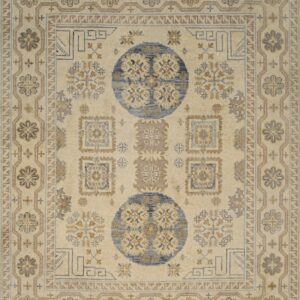 Cream-colored rug with two large blue medallions and geometric patterns in tan and soft blue.