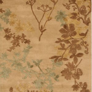 Tan rug featuring a varied-pile floral pattern in brown, gold, and sage green.