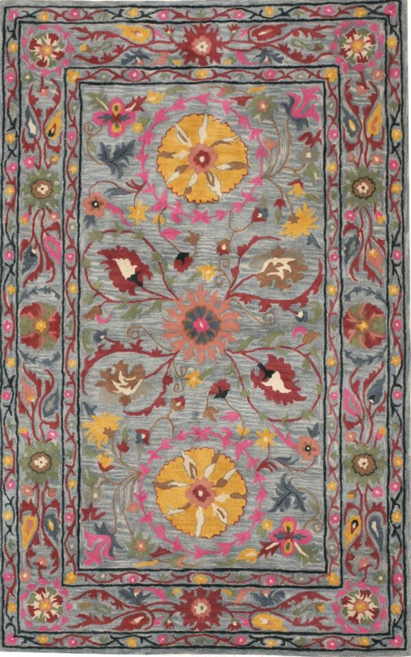 Dusty blue rug with ornate floral patterns in yellow, pink, burgundy, and deep blue borders.