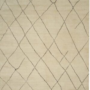A high-pile beige rug with a dark, irregular diamond grid pattern and white fringe.