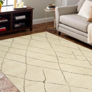 Off-white rug with a thin, irregular dark diamond pattern laid on wood flooring near a gray armchair.