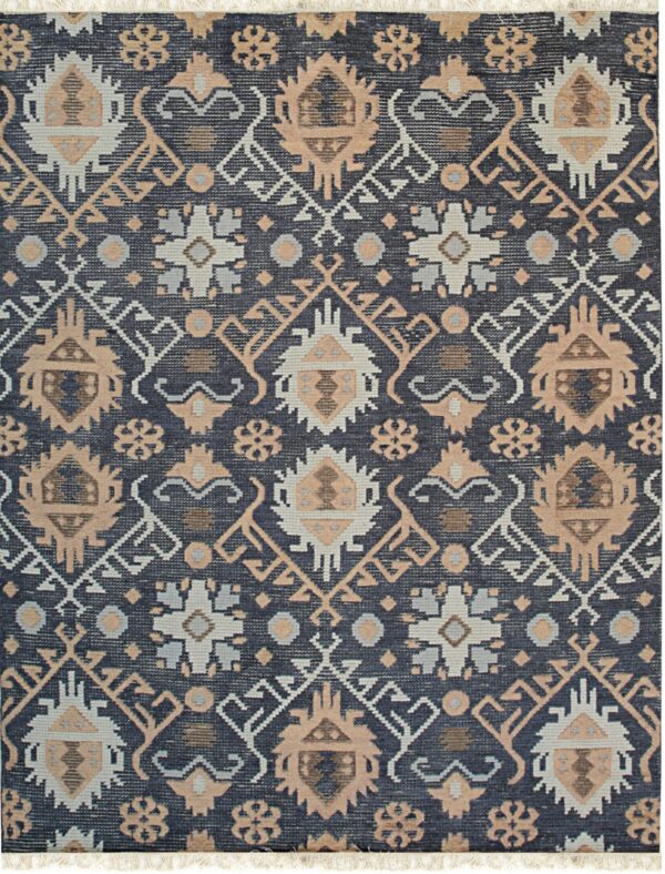 Dark blue rug featuring repeating tribal geometric patterns in beige, pale gray, and white, with short fringe.