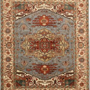 Traditional rug with a slate blue field, rust red medallion, and ivory borders displaying floral motifs.