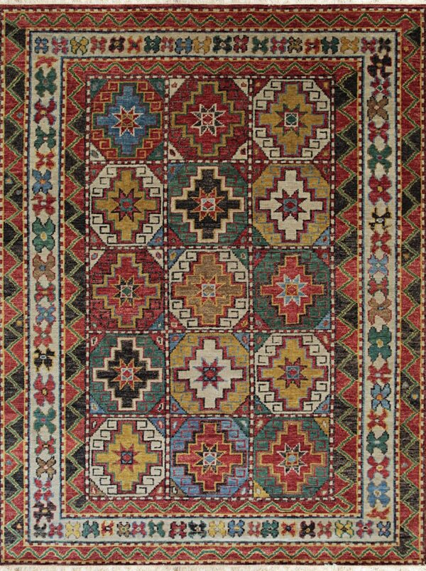 Geometric high-pile rug displaying stepped medallions in red, teal, gold, and cream squares.