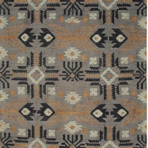 Textured gray rug with a repeating tribal geometric pattern in black, cream, and contrasting orange-gold.