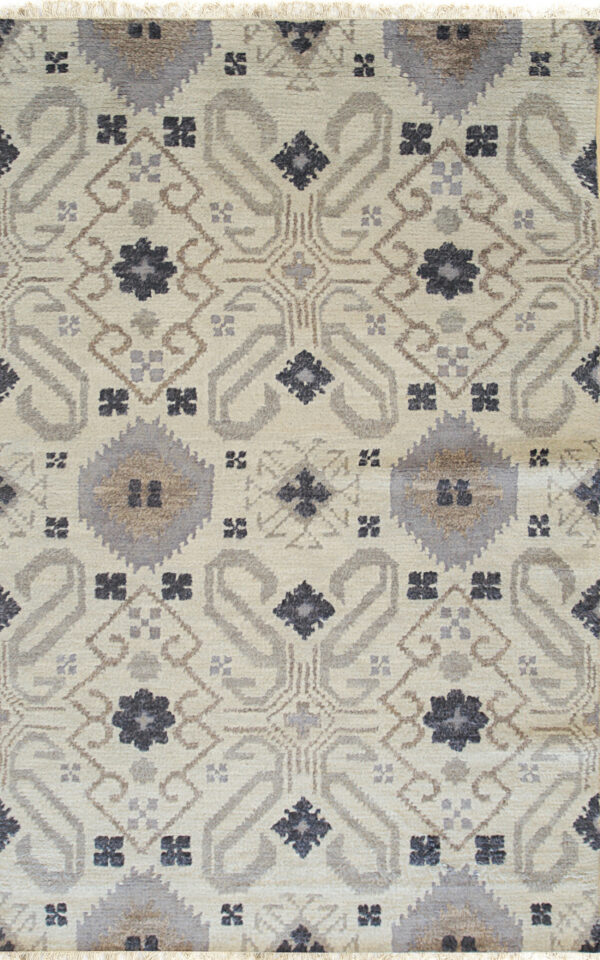 Textured cream rug with ornate repeating geometric medallions in shades of gray and brown, featuring short fringe.
