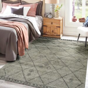 A medium-pile gray and charcoal diamond pattern rug beneath a bed in a bright bedroom setting.