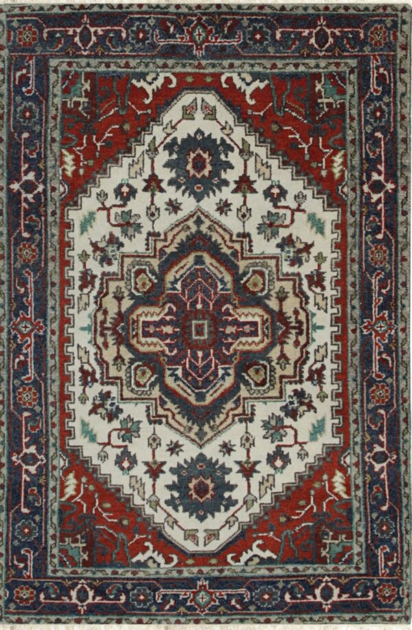 Ivory traditional rug with navy and rust red geometric medallion and floral border motifs.