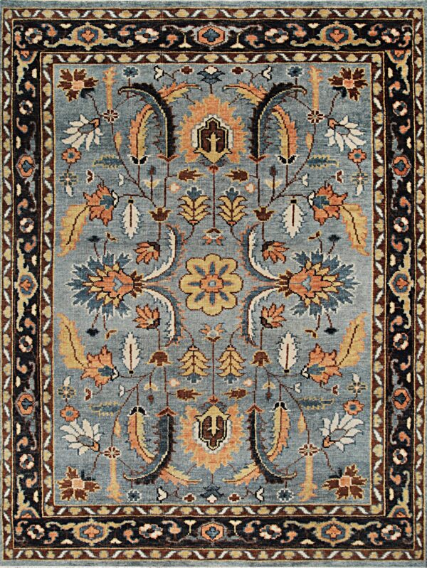 Lydia kazak navy hand knotted wool rug 1 Geometric high-pile rug displaying stepped medallions in gray, blue, brown, and cream squares.