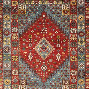 Traditional rug with a red central field and geometric borders in blue, yellow, and white.