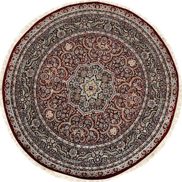 Round traditional burgundy rug with a detailed medallion and concentric borders, displayed on white.