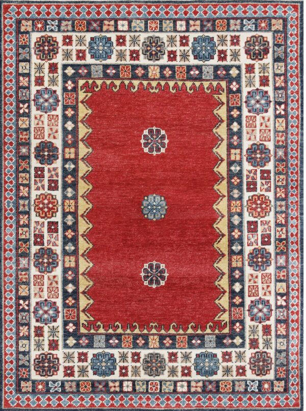 Red rug featuring a minimal center design and complex geometric borders in navy, cream, and blue.