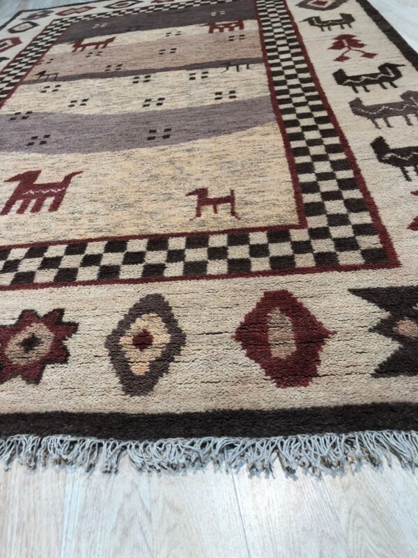 Textured beige rug featuring brown and burgundy stripes, stylized animals, and a checkered main border.
