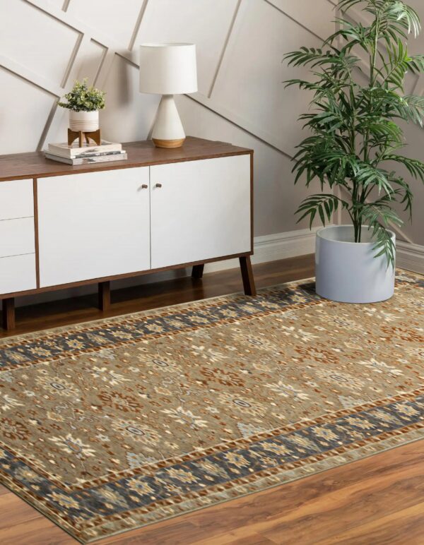 Khaki traditional rug with dark blue border on wood flooring complements a white modern credenza.