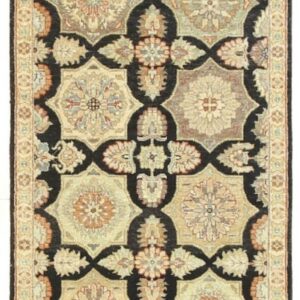 A black runner rug features repeating octagonal medallions in cream, tan, muted green, and rust accents.