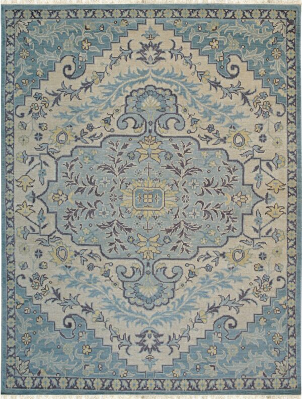 Traditional area rug featuring an ornate floral medallion pattern in teal, beige, and dark grey.