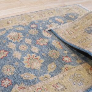 Elegant blue and gold patterned rug