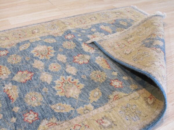 Elegant blue and gold patterned rug