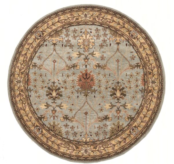 Circular rug with a light blue field and intricate tan and brown traditional floral patterns.