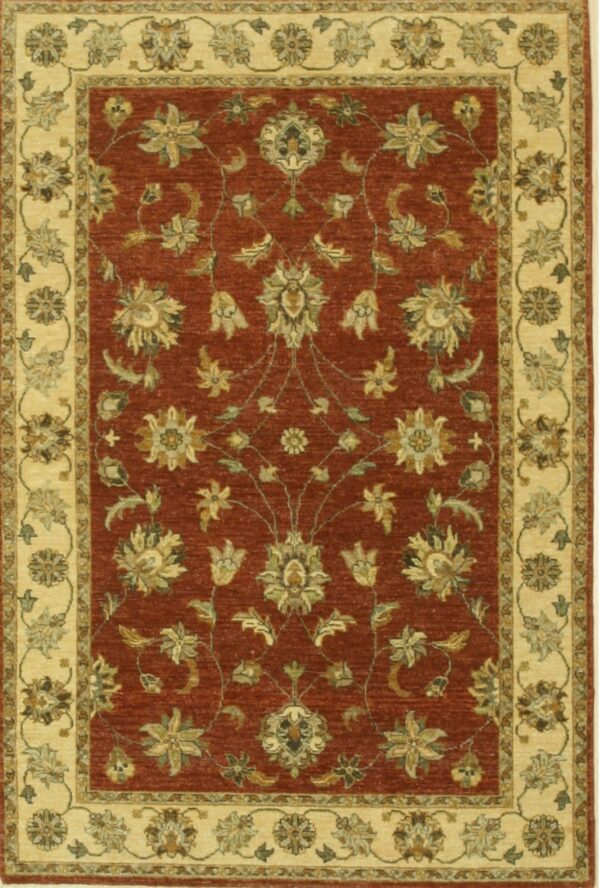 Red and cream traditional rug displaying a symmetric pattern of stylized gold and olive flowers.
