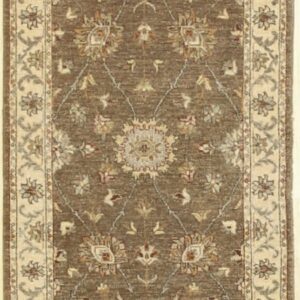 Brown runner rug with an intricate floral trellis pattern and a contrasting wide light beige border.