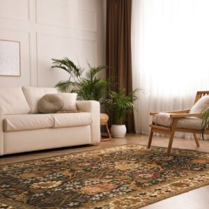 Dark floral area rug anchors a bright room featuring a white sofa, wooden armchair, and potted plants.